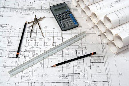 Image of blueprints with drawing equipment